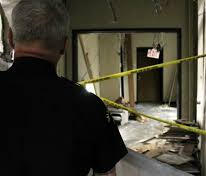 a police officer surveys the damage done after a blast that killed the el centro massacre a police officer surveys the damage done after a blast that killed the el centro massacre